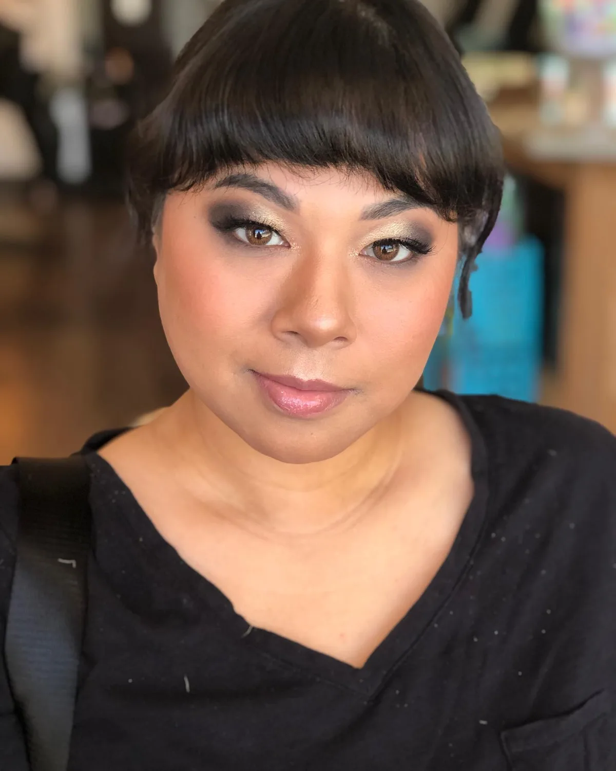 Client with smokey gold eye and soft glam makeup at Dockside Salon in Muskegon, MI