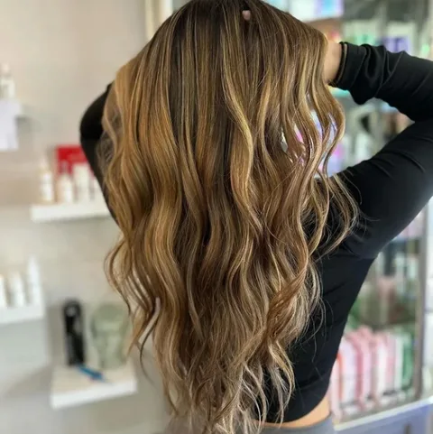 Honey balayage with beachy waves styled at Dockside Salon, Muskegon