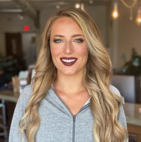 Blonde waves with full glam makeup at Dockside Salon, Muskegon