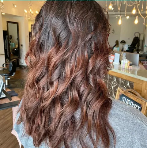 Rich brunette waves with subtle dimension at Dockside Salon, Muskegon