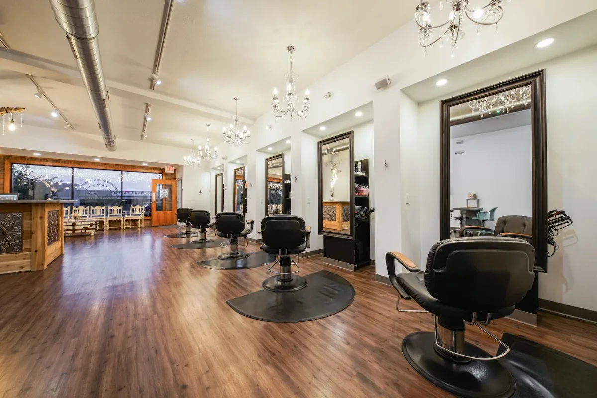 Interior of Dockside Salon & Day Spa in Lakeside Muskegon, MI with chandeliers and styling chairs