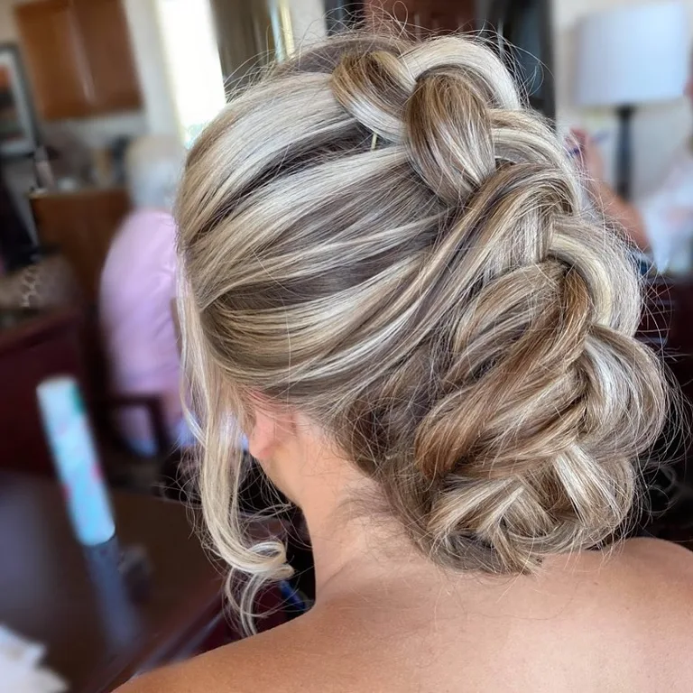 Textured braided updo styled at Dockside Salon in Muskegon, MI